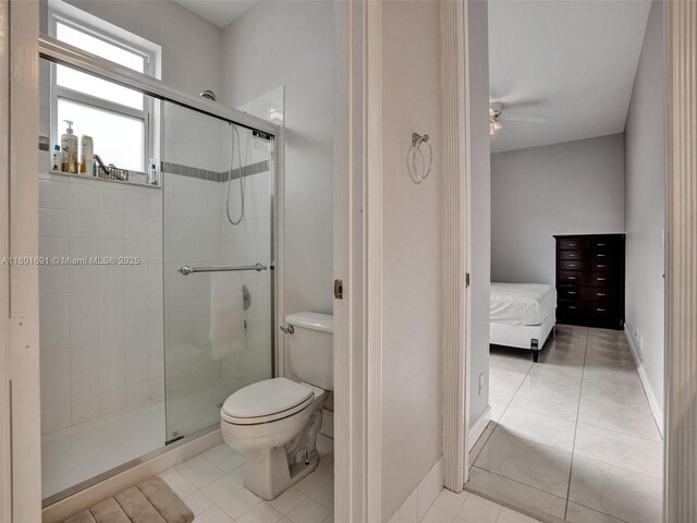 4985 NW 120th Ave, Coral Springs, FL 33076 - ensuite bathroom featuring a stall shower, tile patterned flooring, and toilet