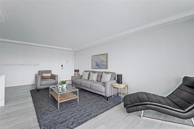 137 Golden Isles Dr Unit 305, Hallandale Beach, FL 33009 - living area with wood finished floors and baseboards
