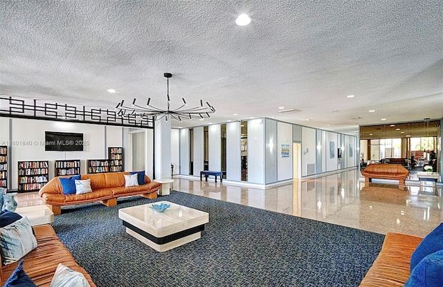 137 Golden Isles Dr Unit 305, Hallandale Beach, FL 33009 - community lobby featuring recessed lighting and a textured ceiling