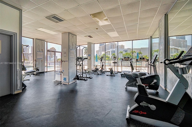 137 Golden Isles Dr Unit 305, Hallandale Beach, FL 33009 - exercise room with floor to ceiling windows and a city view