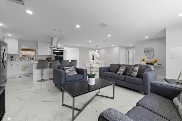 6307 NW 19th Ct, Margate, FL 33063 - living room featuring light marble finish flooring and recessed lighting