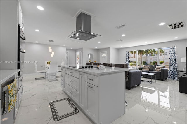 6307 NW 19th Ct, Margate, FL 33063 - kitchen featuring island exhaust hood, light marble finish floors, black electric cooktop, open floor plan, and recessed lighting