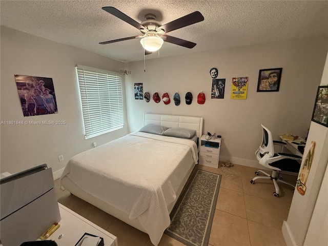 1751 SW 87th Ter, Miramar, FL 33025 - tiled bedroom featuring a textured ceiling, baseboards, and a ceiling fan