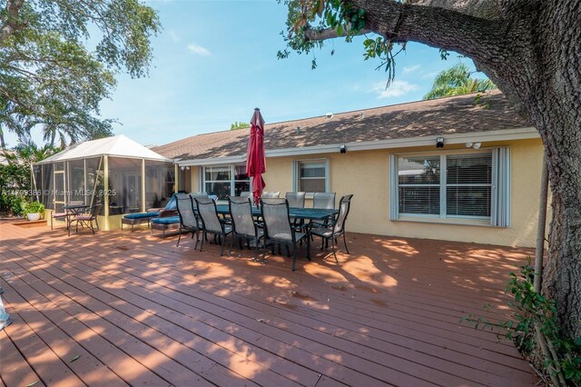 wooden deck with outdoor dining area