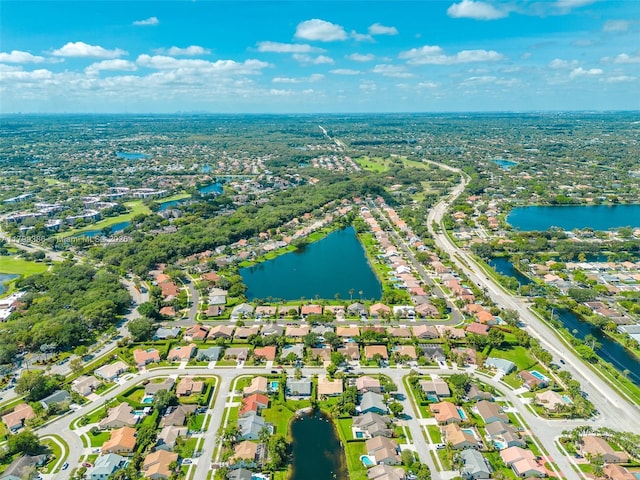 aerial view of residential area with a large body of water