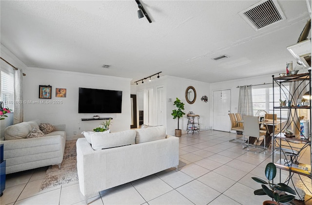 6400 Sheridan St, Hollywood, FL 33024 - living area with track lighting, light tile patterned floors, and a textured ceiling