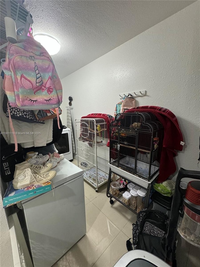 8098 NW 99th Ter, Hialeah Gardens, FL 33016 - washroom with a textured ceiling and a textured wall