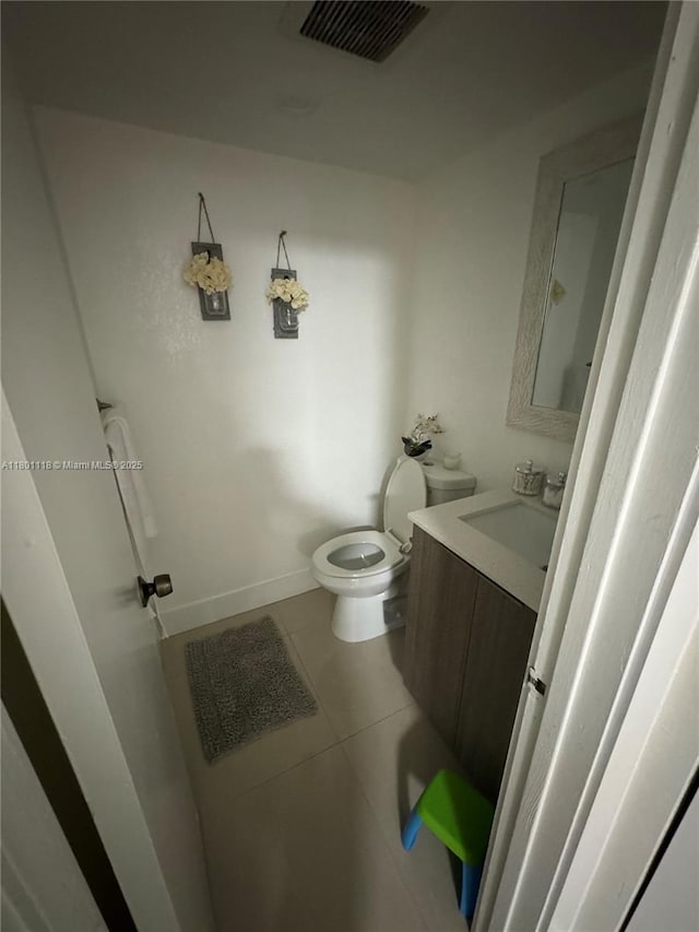 8098 NW 99th Ter, Hialeah Gardens, FL 33016 - half bath featuring tile patterned floors, vanity, toilet, and baseboards
