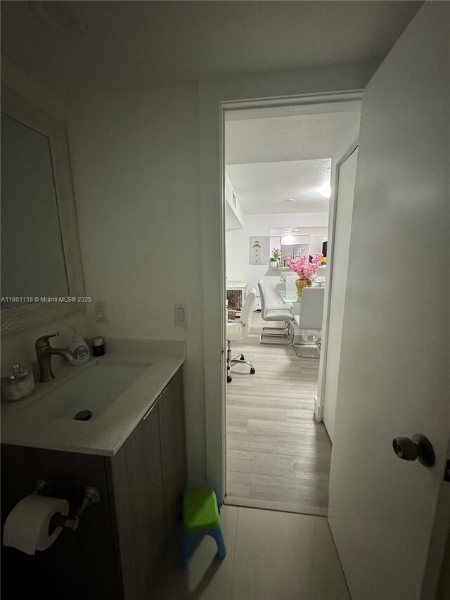 8098 NW 99th Ter, Hialeah Gardens, FL 33016 - bathroom featuring vanity and wood finished floors