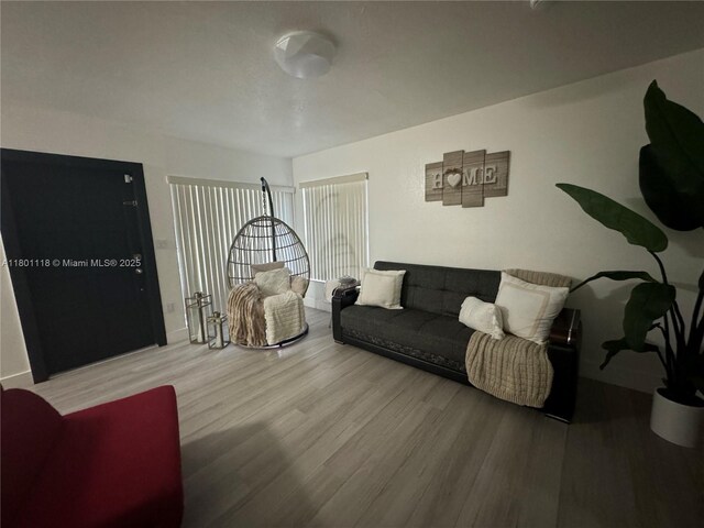 8098 NW 99th Ter, Hialeah Gardens, FL 33016 - living room featuring wood finished floors