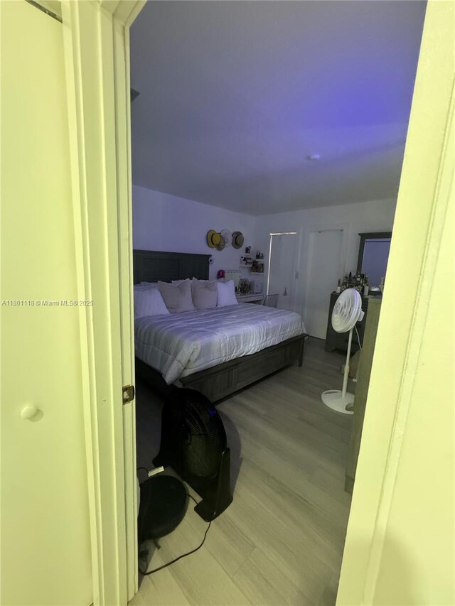 8098 NW 99th Ter, Hialeah Gardens, FL 33016 - bedroom featuring wood finished floors