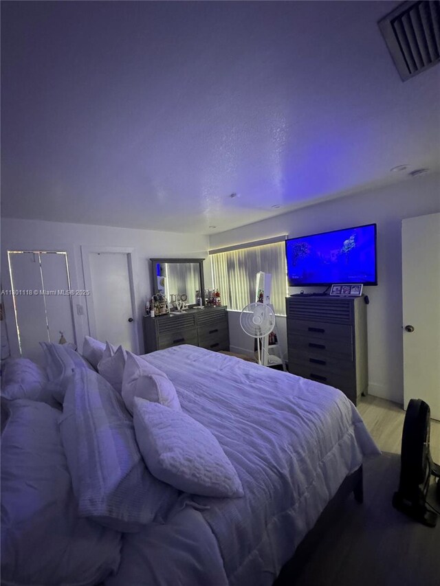 8098 NW 99th Ter, Hialeah Gardens, FL 33016 - bedroom featuring wood finished floors