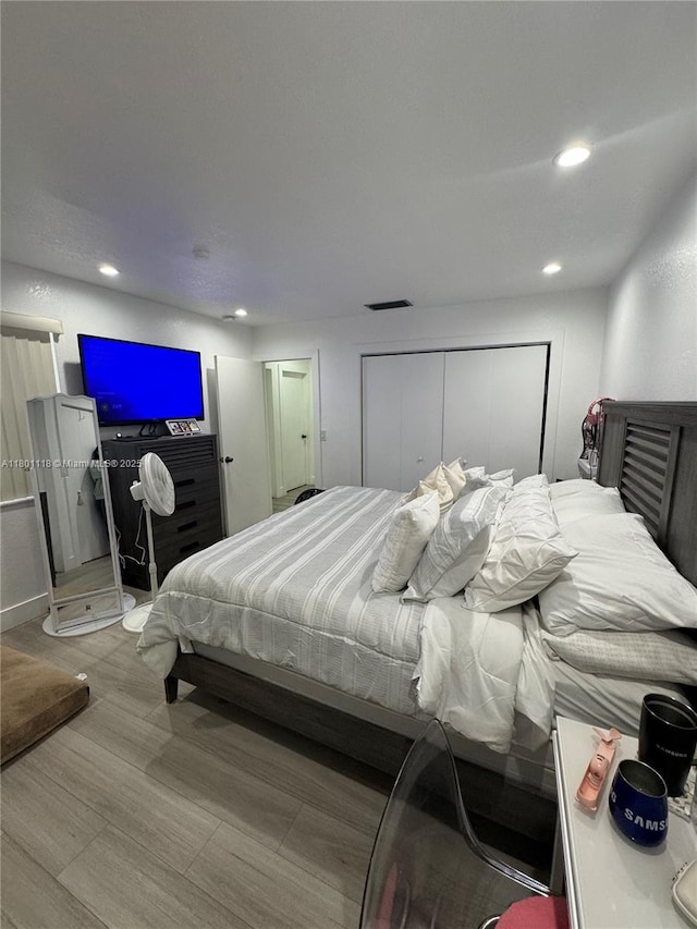 8098 NW 99th Ter, Hialeah Gardens, FL 33016 - bedroom featuring recessed lighting and wood finished floors