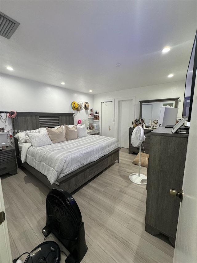 8098 NW 99th Ter, Hialeah Gardens, FL 33016 - bedroom with light wood-type flooring and recessed lighting