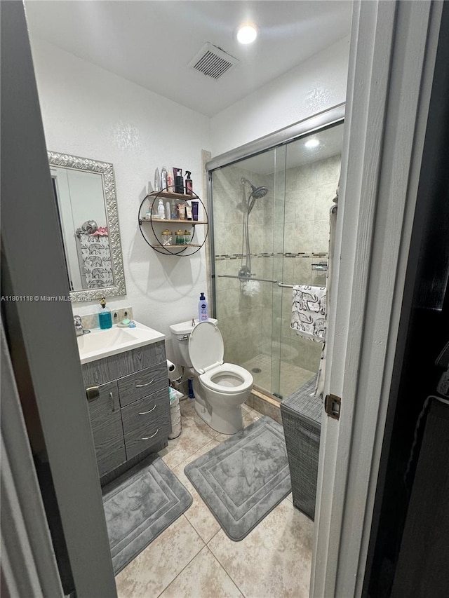 8098 NW 99th Ter, Hialeah Gardens, FL 33016 - bathroom featuring tile patterned flooring, a shower stall, toilet, and vanity