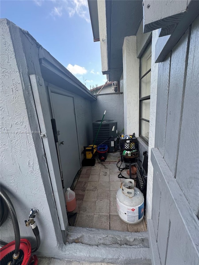 8098 NW 99th Ter, Hialeah Gardens, FL 33016 - view of home's exterior with central air condition unit