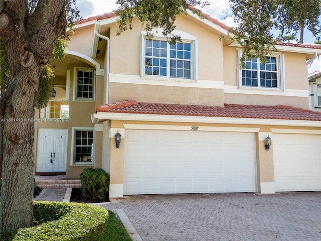 5087 SW 183rd Ave, Miramar, FL 33029 - multi unit property with driveway, stucco siding, and a garage