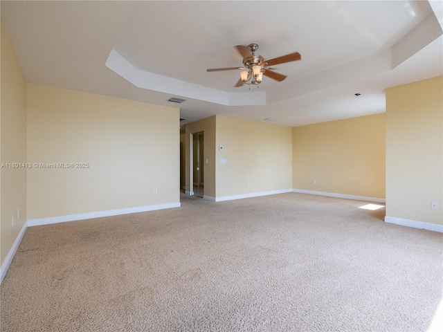 5087 SW 183rd Ave, Miramar, FL 33029 - spare room with ceiling fan, a raised ceiling, light colored carpet, and baseboards