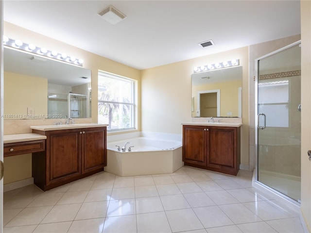 5087 SW 183rd Ave, Miramar, FL 33029 - bathroom featuring a shower stall, two vanities, a bath, and tile patterned flooring