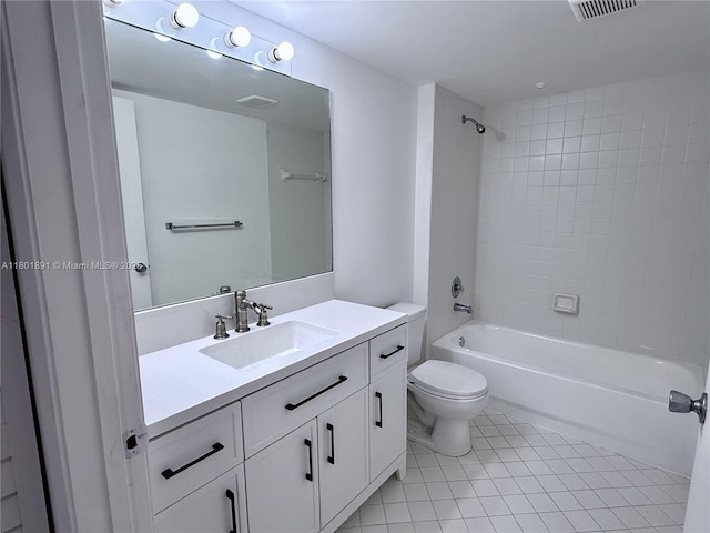 full bathroom featuring toilet, vanity, tile patterned flooring, and bathtub / shower combination