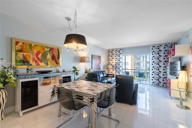 16900 NE 14th Ave Unit 201, North Miami Beach, FL 33162 - dining room with light tile patterned flooring and a chandelier