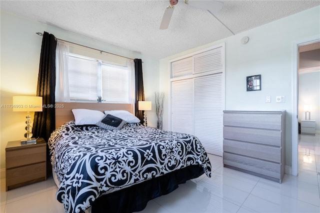 16900 NE 14th Ave Unit 201, North Miami Beach, FL 33162 - bedroom with a textured ceiling, ceiling fan, and a closet