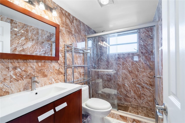 16900 NE 14th Ave Unit 201, North Miami Beach, FL 33162 - bathroom with toilet, a shower stall, vanity, and tile walls