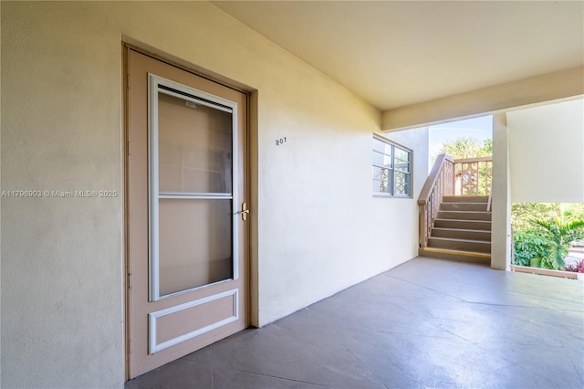 16900 NE 14th Ave Unit 201, North Miami Beach, FL 33162 - doorway to property with stucco siding and a patio