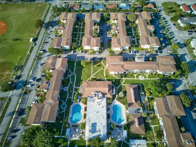 16900 NE 14th Ave Unit 201, North Miami Beach, FL 33162 - aerial view of property and surrounding area featuring a pool area and nearby suburban area