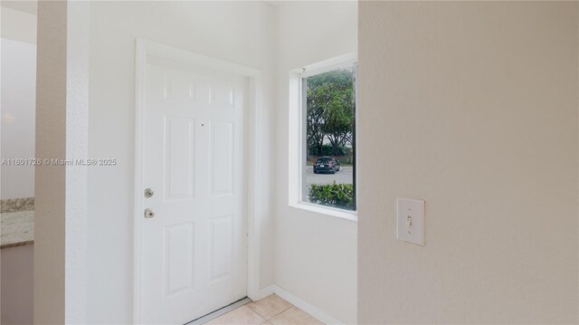 7818 Catalina Cir, Tamarac, FL 33321 - entryway with light tile patterned floors and baseboards