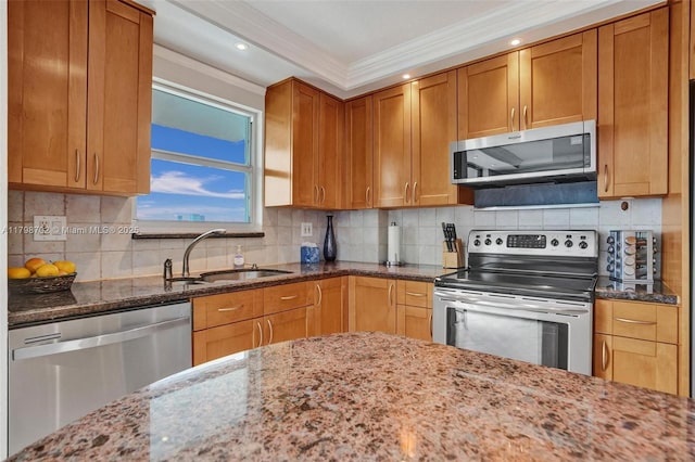 137 Golden Isles Dr Unit 1105, Hallandale Beach, FL 33009 - kitchen with stainless steel appliances, a sink, ornamental molding, light stone countertops, and tasteful backsplash