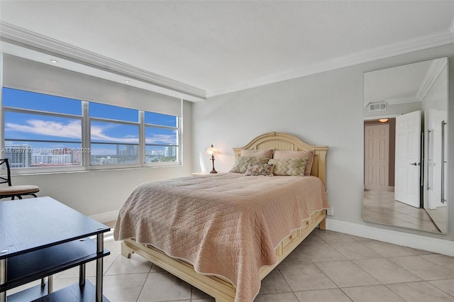 137 Golden Isles Dr Unit 1105, Hallandale Beach, FL 33009 - bedroom with light tile patterned flooring, baseboards, and crown molding