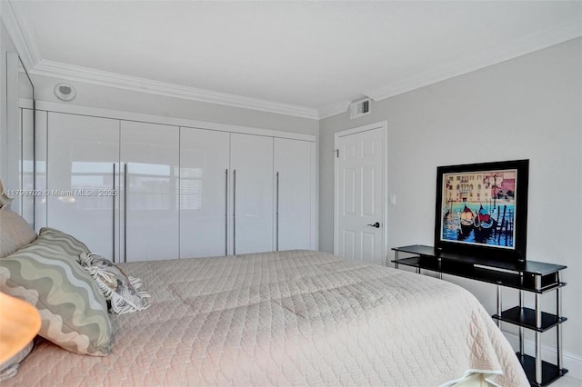 137 Golden Isles Dr Unit 1105, Hallandale Beach, FL 33009 - bedroom featuring crown molding, a closet, and baseboards