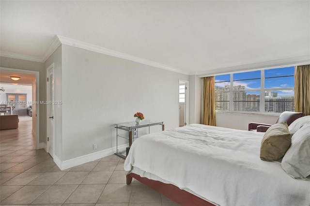 137 Golden Isles Dr Unit 1105, Hallandale Beach, FL 33009 - bedroom with light tile patterned flooring, baseboards, and crown molding