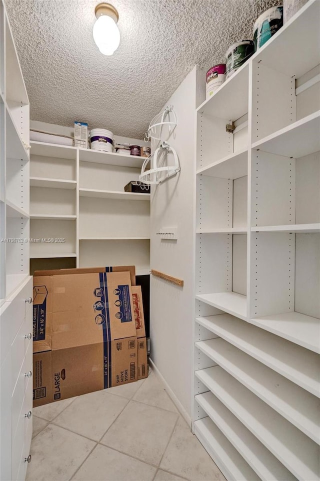 137 Golden Isles Dr Unit 1105, Hallandale Beach, FL 33009 - walk in closet with tile patterned floors