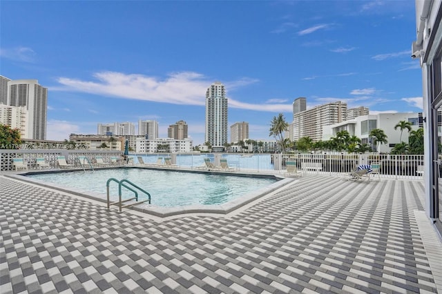 137 Golden Isles Dr Unit 1105, Hallandale Beach, FL 33009 - community pool with fence and a patio area