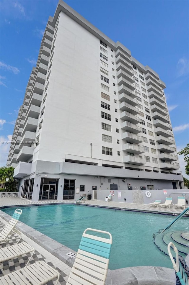 137 Golden Isles Dr Unit 1105, Hallandale Beach, FL 33009 - community pool featuring a patio area