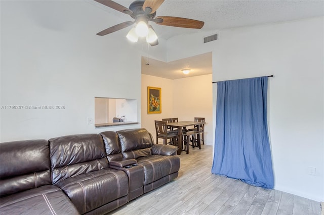 2301 NW 96th Ter Unit 16C, Pembroke Pines, FL 33024 - living area with light wood finished floors, ceiling fan, and high vaulted ceiling
