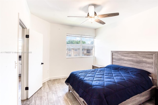 2301 NW 96th Ter Unit 16C, Pembroke Pines, FL 33024 - bedroom with wood finished floors, ceiling fan, and baseboards