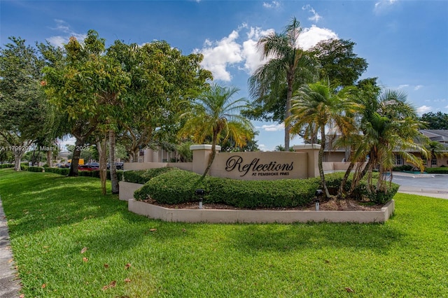 2301 NW 96th Ter Unit 16C, Pembroke Pines, FL 33024 - community sign featuring a lawn