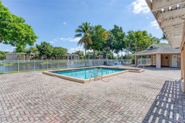 2301 NW 96th Ter Unit 16C, Pembroke Pines, FL 33024 - community pool with a patio area and fence