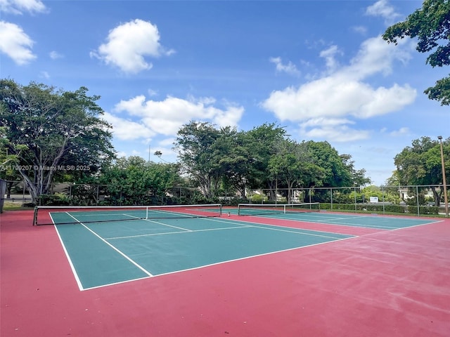 2301 NW 96th Ter Unit 16C, Pembroke Pines, FL 33024 - view of tennis court featuring community basketball court, fence, and view of scattered trees