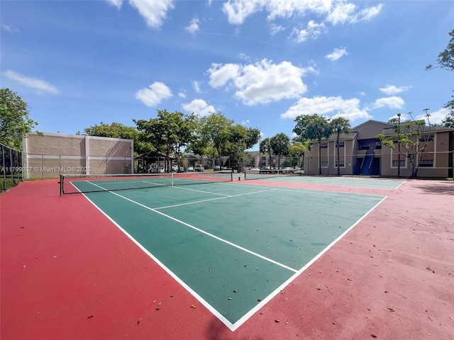 2301 NW 96th Ter Unit 16C, Pembroke Pines, FL 33024 - view of tennis court featuring fence and community basketball court