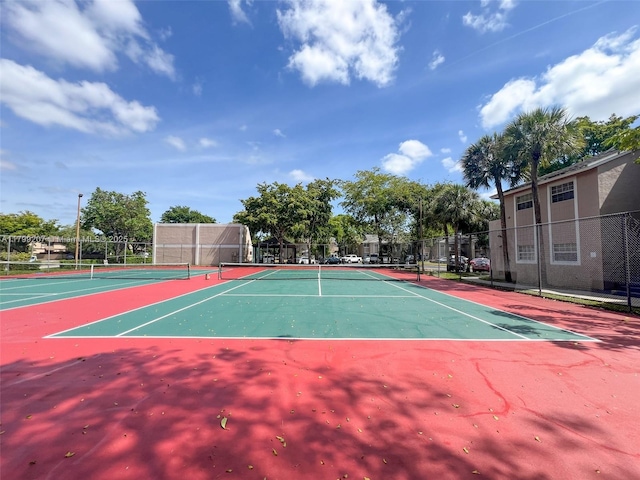 2301 NW 96th Ter Unit 16C, Pembroke Pines, FL 33024 - view of tennis court featuring fence and community basketball court