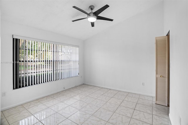 10300 Laurel Ct, Pembroke Pines, FL 33026 - spare room with vaulted ceiling, a ceiling fan, and baseboards