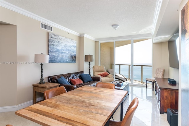 16699 Collins Ave Unit 3401, Sunny Isles Beach, FL 33160 - dining space featuring expansive windows, light tile patterned floors, a textured ceiling, crown molding, and baseboards