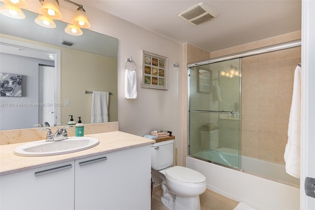 16699 Collins Ave Unit 3401, Sunny Isles Beach, FL 33160 - bathroom featuring enclosed tub / shower combo, vanity, tile patterned floors, and toilet