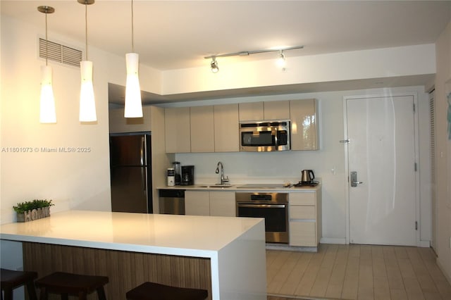 2602 E Hallandale Beach Blvd Unit R408, Hallandale Beach, FL 33009 - kitchen with black appliances, a sink, light countertops, a kitchen breakfast bar, and a peninsula