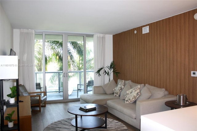2602 E Hallandale Beach Blvd Unit R408, Hallandale Beach, FL 33009 - living room with floor to ceiling windows, wood finished floors, and wood walls