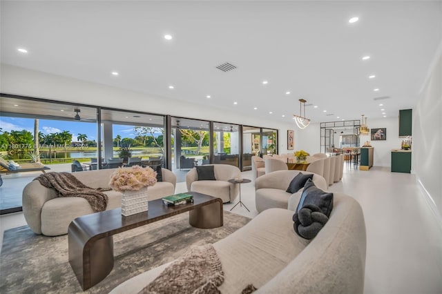 4430 Casper Ct, Hollywood, FL 33021 - living area with recessed lighting, a water view, and finished concrete floors